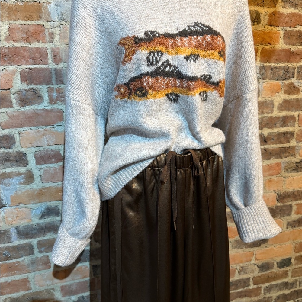 Gray Sweater with Fish Design and silk brown pants.